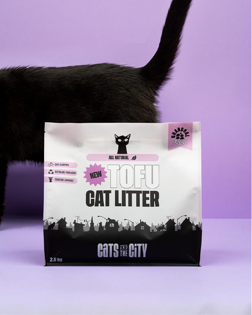 Cat behind tofu cat litter charcoal
